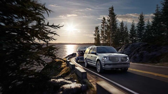 lincoln navigator suv towing a boat