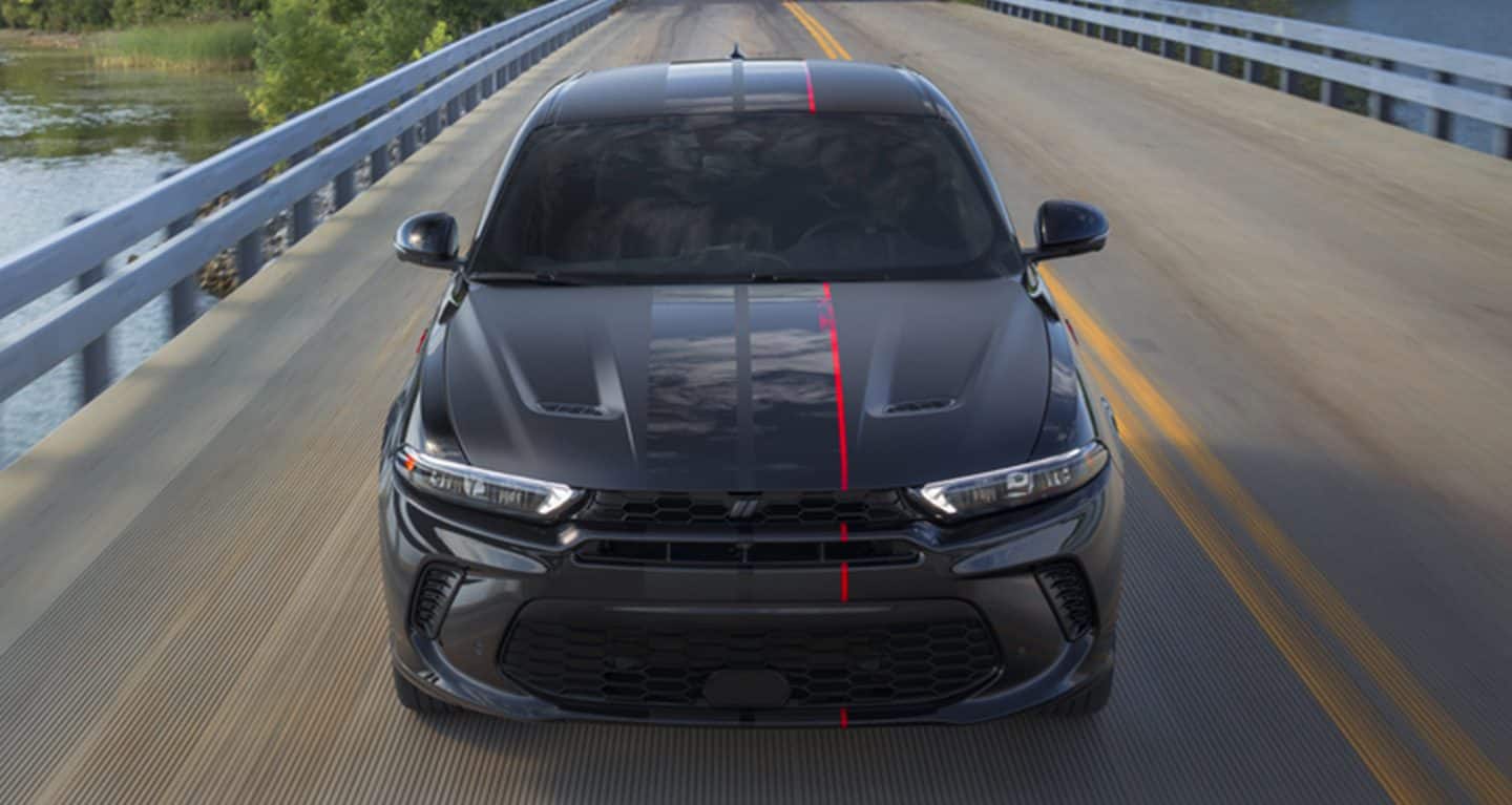 black Dodge Hornet muscle car on a race track