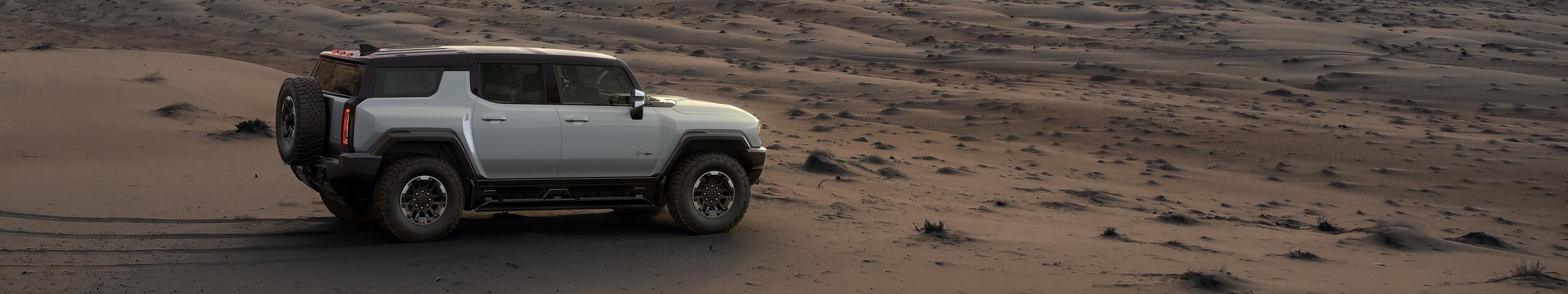 Hummer EV SUV in a desert