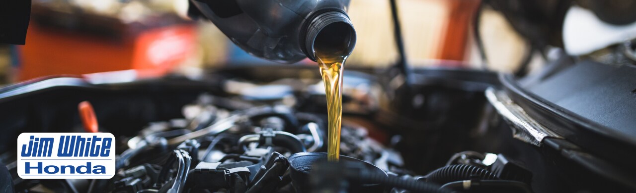 Schedule%20Professional%20Auto%20Repairs%20at%20the%20Jim%20White%20Honda%20Service%20Department1.jpg Honda vehicle receiving oil service and replacement by certified Honda service technicians serving Toledo and Lucas County.