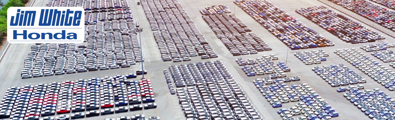 Used%20Trucks%20for%20Sale%20in%20Toledo%2C%20Ohio%20%E2%80%93%20Shop%20Jim%20White%20Honda.png Happy customer receiving keys for a used truck at Jim White Honda showroom