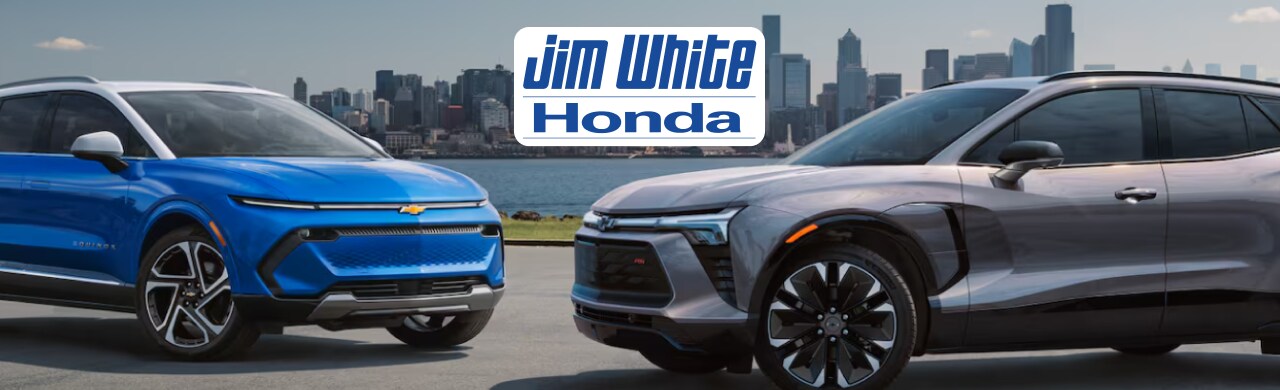 Shopping%20for%20a%20Chevy%20in%20Toledo%2C%20Ohio%20Try%20Jim%20White%20Honda%20First.png A row of used Chevy trucks on display at Jim White Honda in Toledo