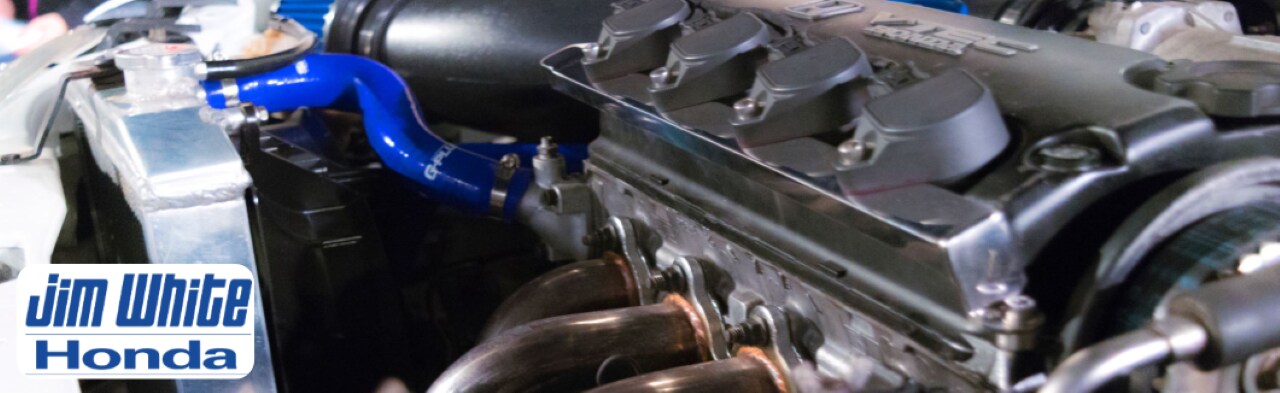 Honda%20Parts%20near%20Toledo%2C%20OH%20%20OEM%20Parts%20%26%20Accessories%20%20Jim%20White%20Honda.png Service technician installing OEM Honda parts in a vehicle at Jim White Honda Maumee dealership.