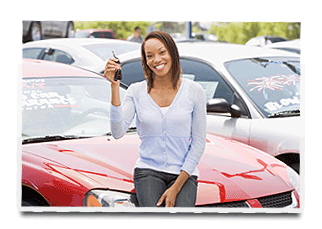 a woman sitting on her red car holding car keys.