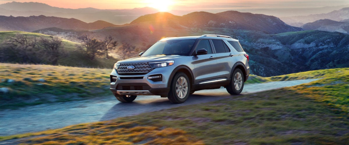 2019 Ford Explorer A silver 2020 Ford Explorer driving through the countryside