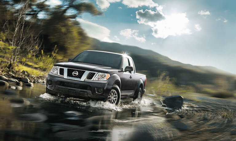 19Frontier_Drivingthroughacreek_5x3