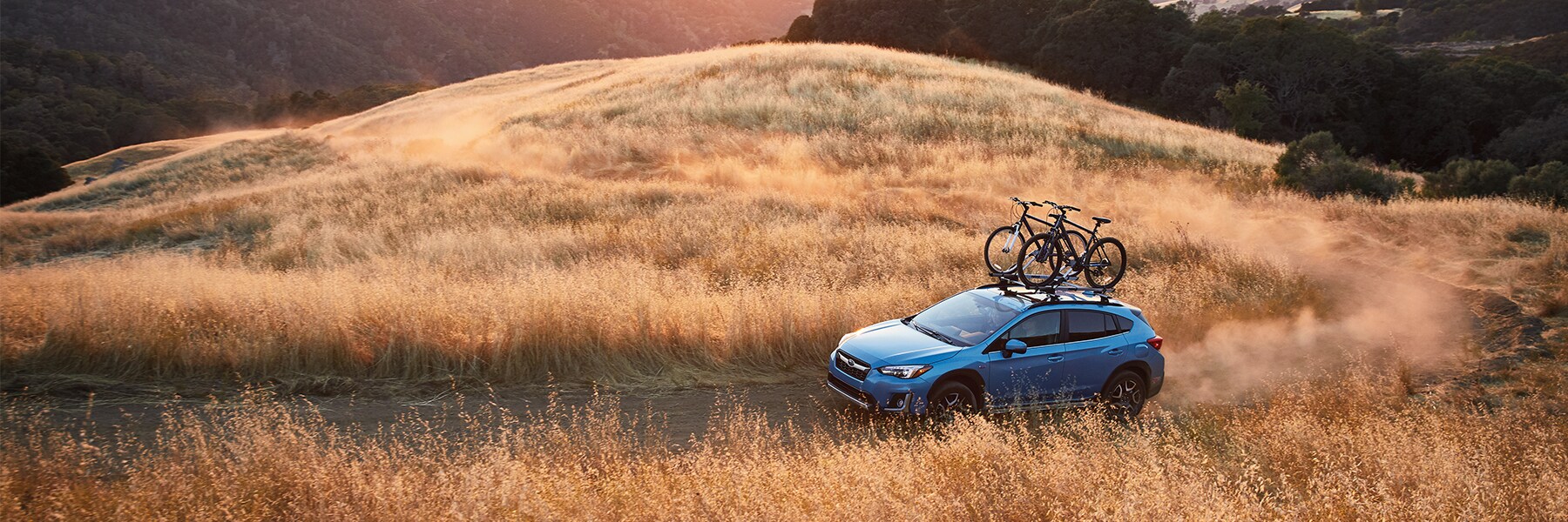 Subaru Crosstrek driving through plains