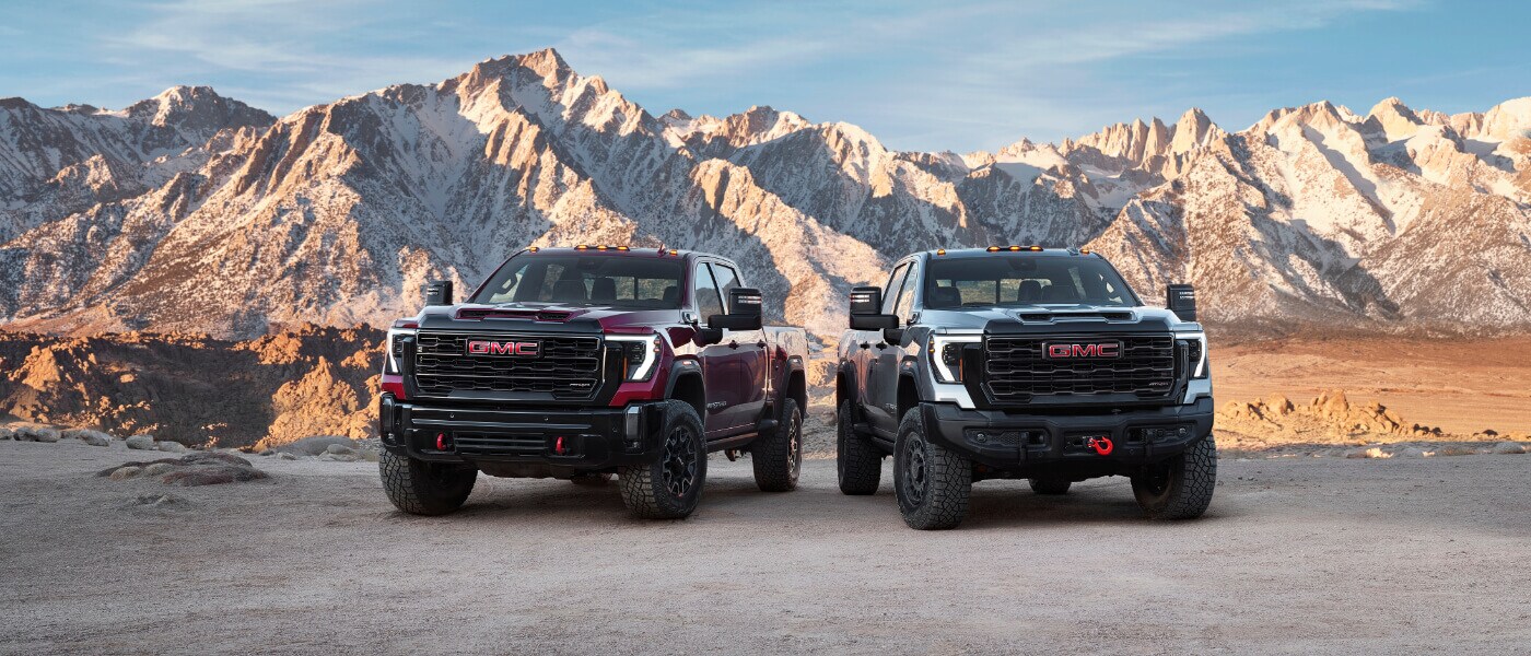 2025 GMC Sierra 2500 Exterior Two In Front Of Mountains