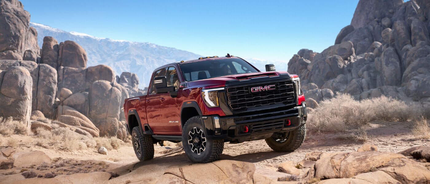 2025 GMC Sierra 2500 Exterior Parked In Front Of Rocks
