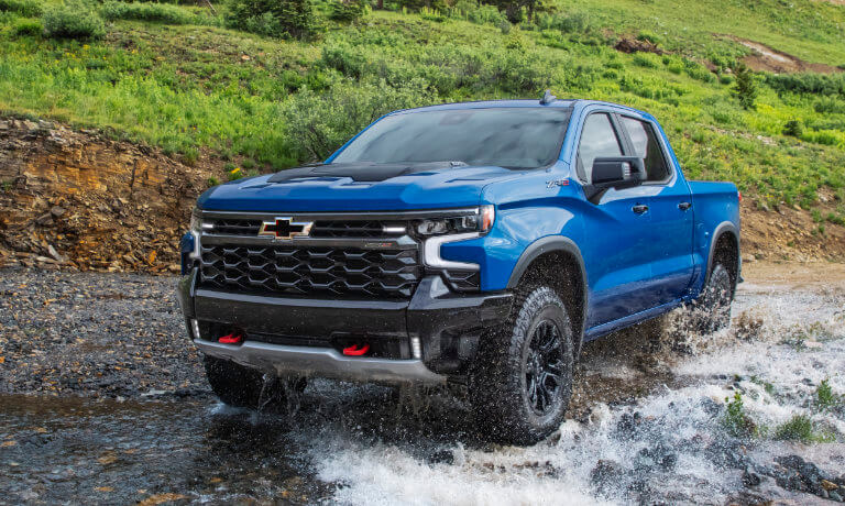 2025 Chevy Silverado 1500 driving in a stream