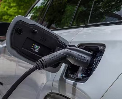 2025 Jeep Wagoneer S Charging at a charging station