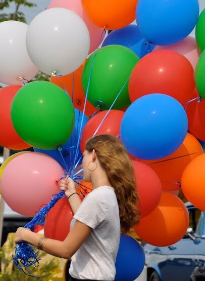 Chad's daughter with the ballons.JPG