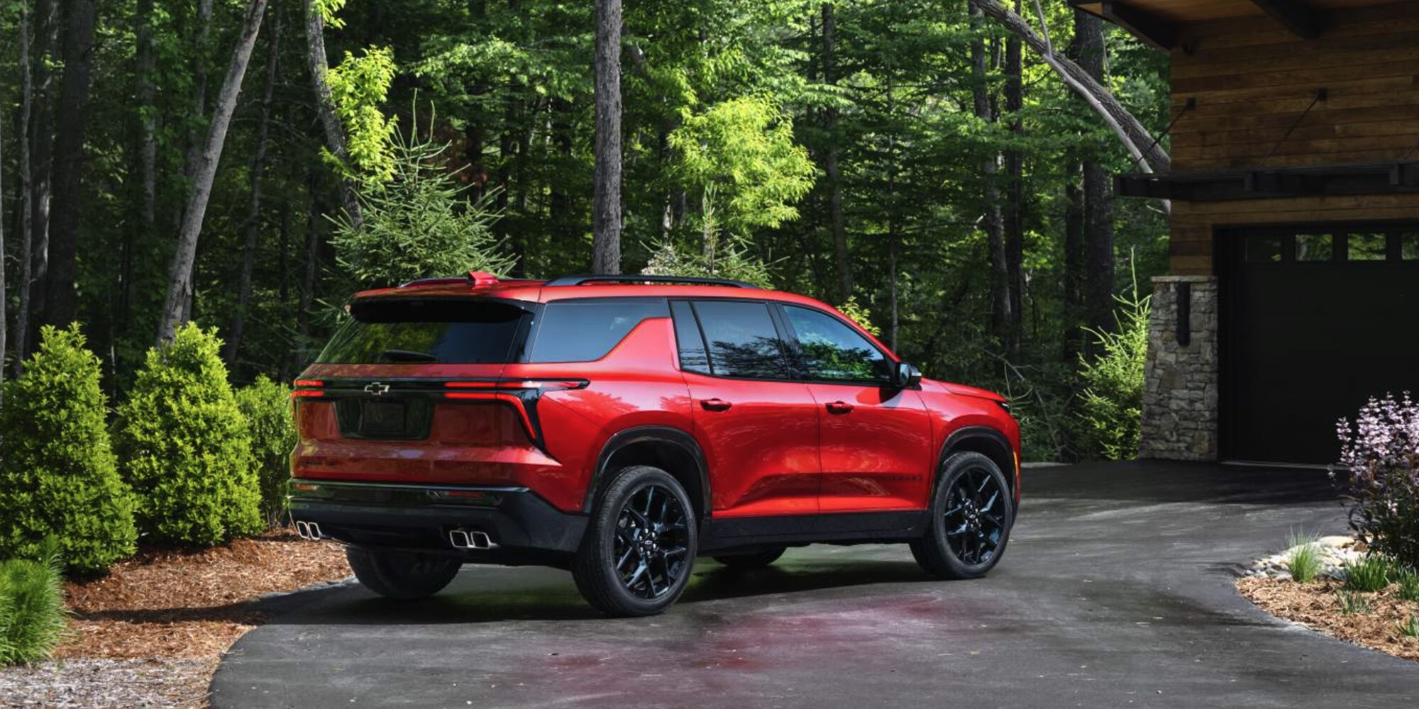 2025 Chevy Traverse parked outside of a cabin 2025 Chevy Traverse parked outside of a cabin