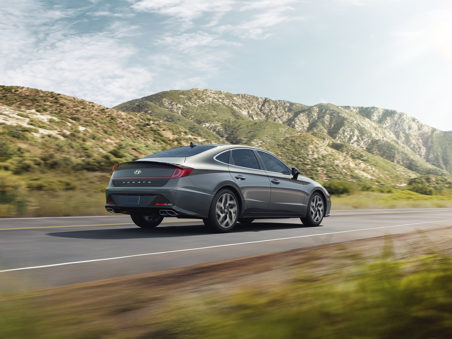 2021-Hyundai-Sonata-NLine-Sedan-L02.png grey Hyundai Sonata car driving in the Santa Clarita hills
