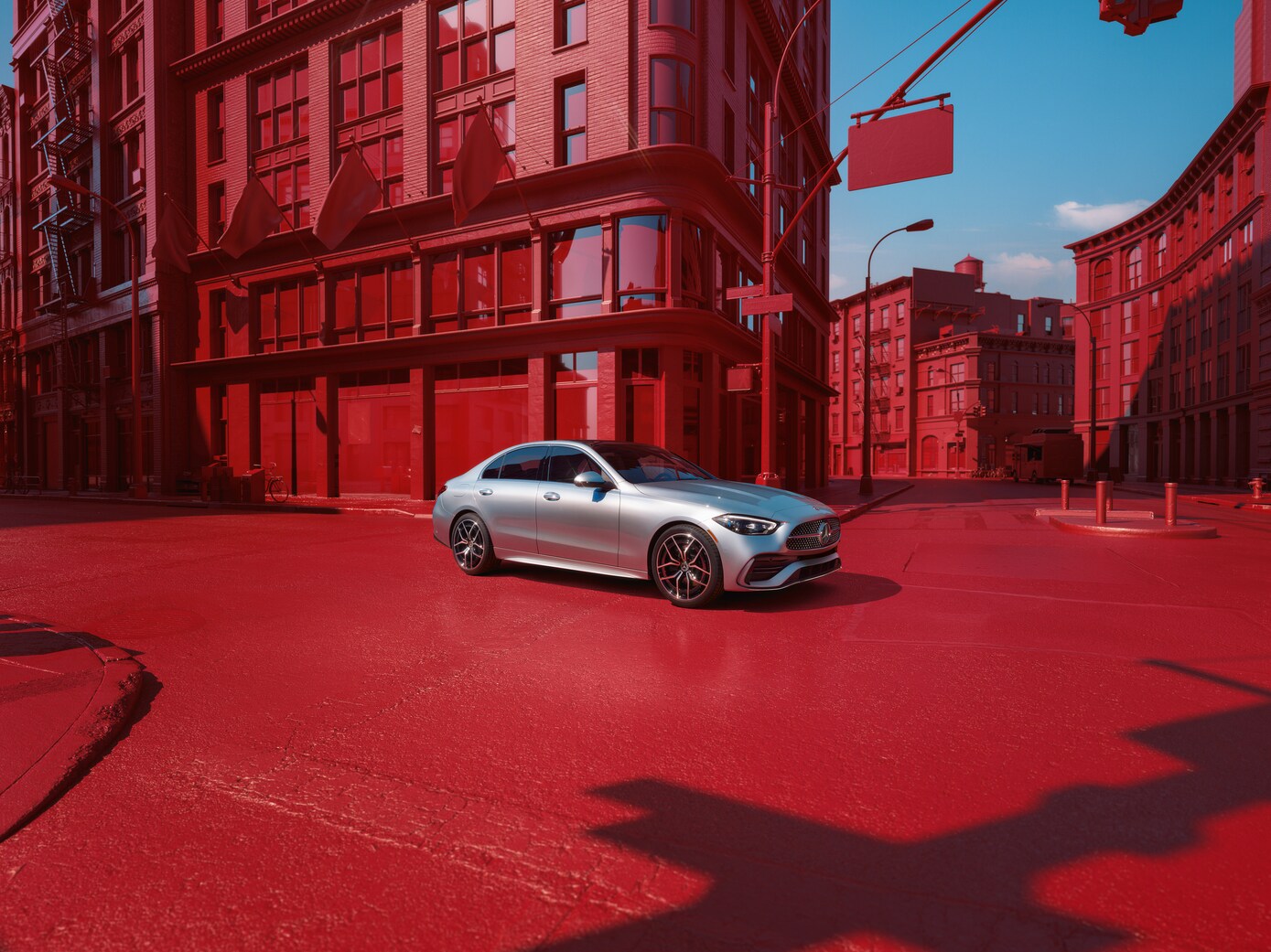 Mercedes-Benz C-Class silver Mercedes-Benz C-Class with red building and street background