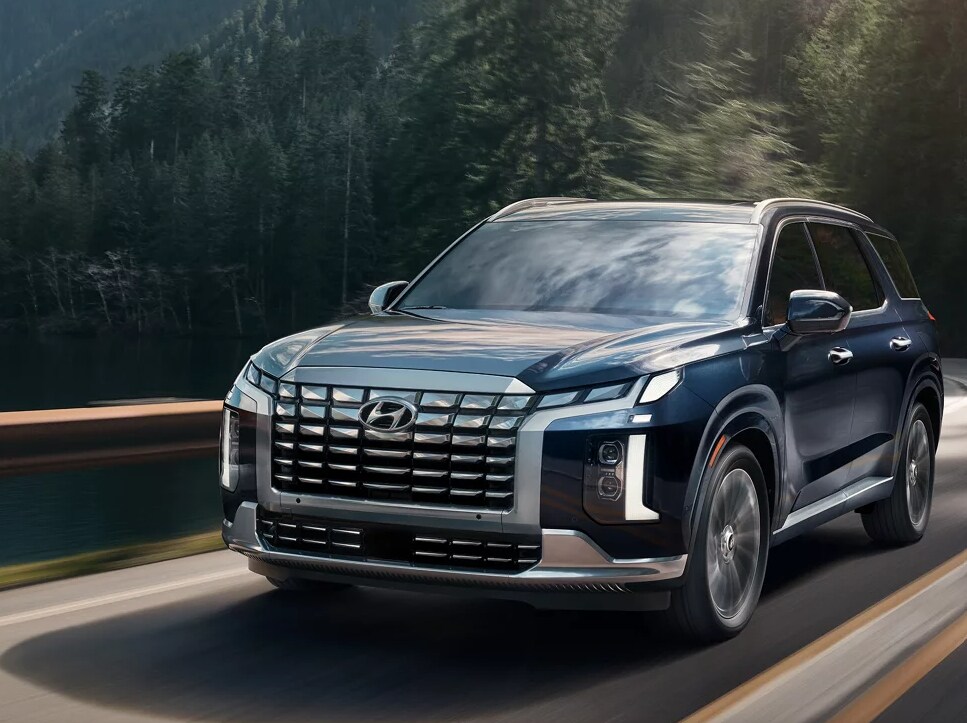 2025 Hyundai Palisade being driven along a scenic road