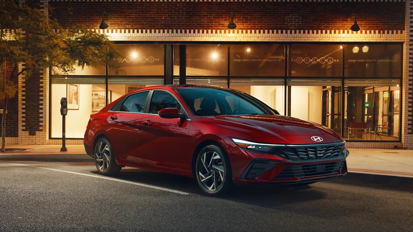 Red 2025 Hyundai Elantra parked outside a restaurant Red 2025 Hyundai Elantra parked outside a restaurant