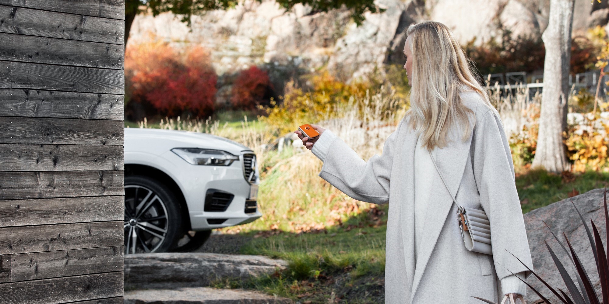 woman in front of volvo