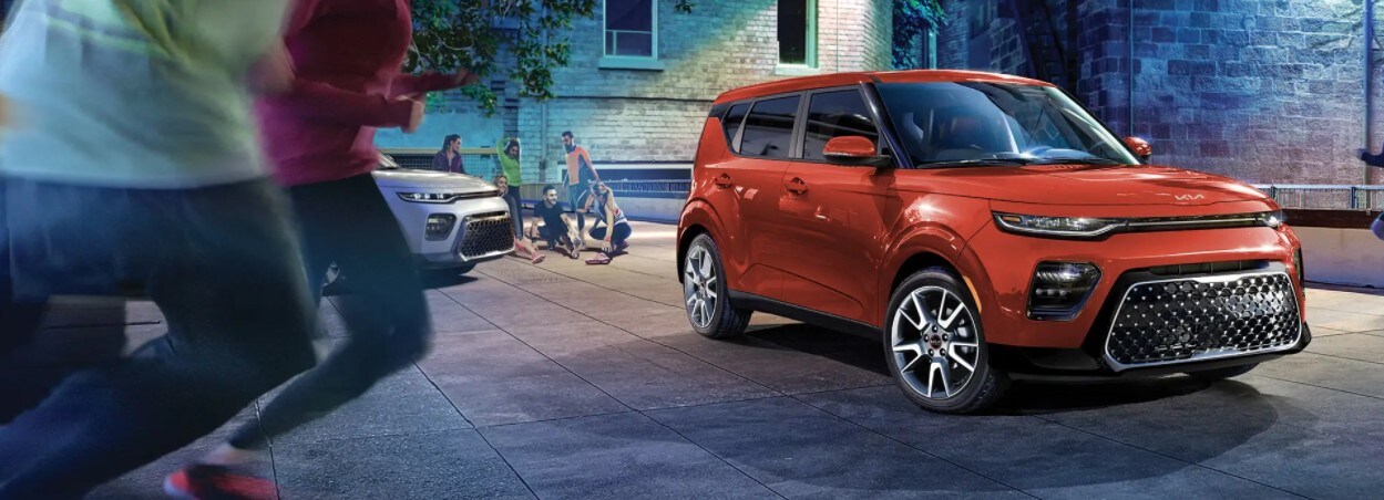 2022 Kia Soul In Lunar Orange 2022 Kia Soul In Lunar Orange, with Families around it at night