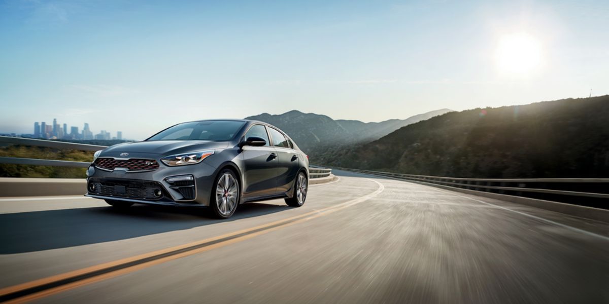 2021 Kia Forte GT in motion cityscape in background-res.jpeg