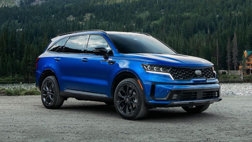 Kia of New Bern is a car dealership near Trenton, NC. | 2021 Kia Sorento in woods