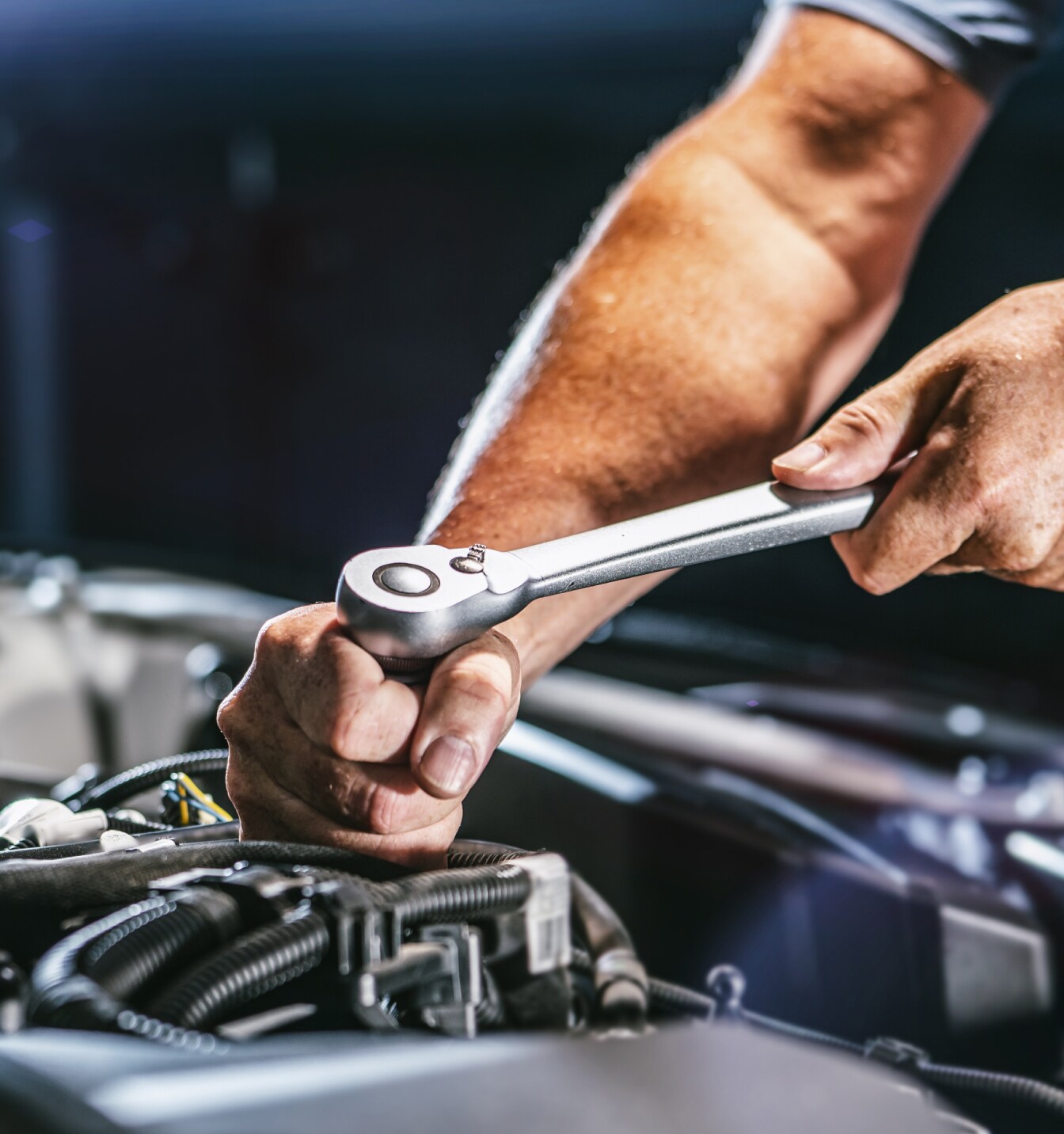 Close-up of auto mechanic servicing a Toyota RAV4