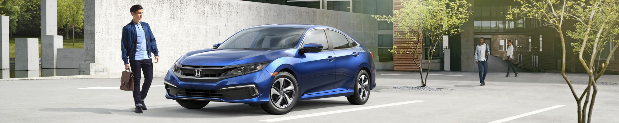 2020-Honda-Civic-LX-Sedan-L02 (1).jpg Honda Civic outside a business