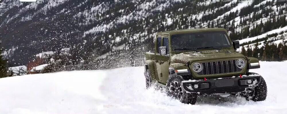 2025 Jeep Gladiator driving in the snow