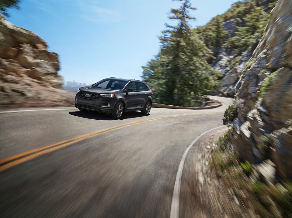 2023 Ford Edge in gray driving on road