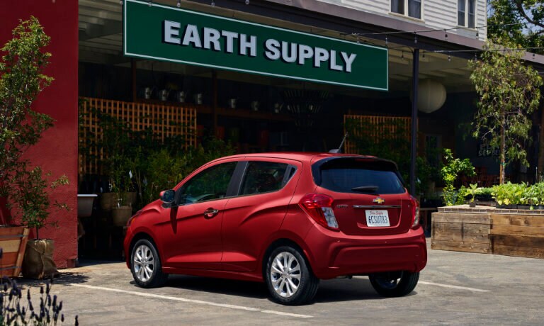2022 Chevrolet Spark exterior parked in front of shop