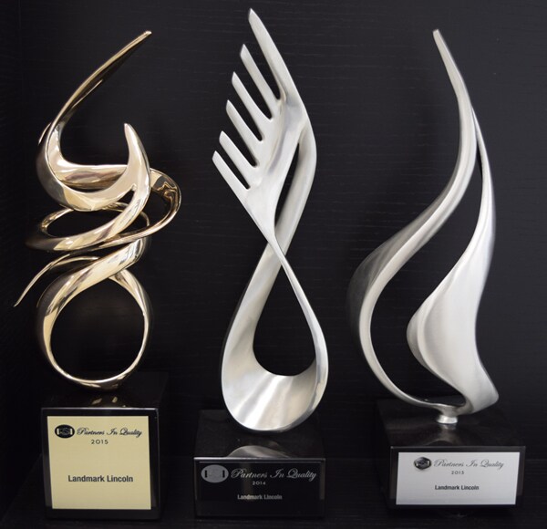 Partners in Quality Award With 3.jpg
