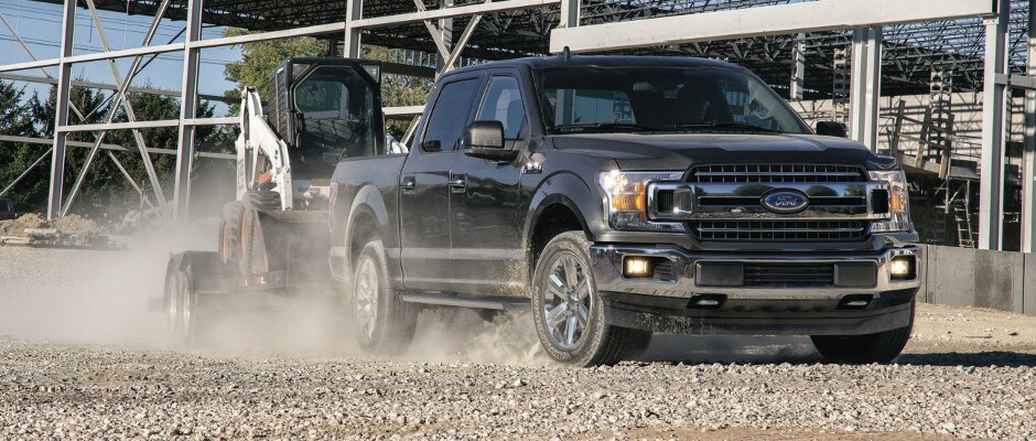 Finance or Lease an F-150 Today A Ford F-150 towing construction equipment