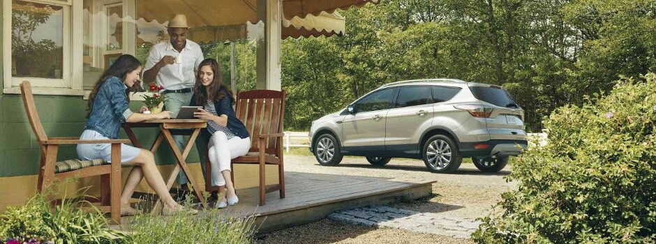 2018 Ford Escape S vs. SE vs. SEL vs. Titanium A group of friend at a cabin with their Ford Escape
