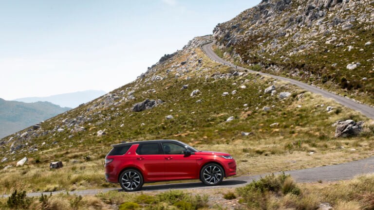 2023 Land Rover Discovery Sport Exterior Driving Up Mountain