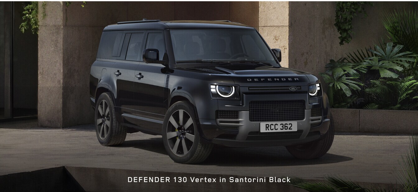 Front three-quarter view of a Land Rover Defender 130 Vertex SUV in Santorini Black.