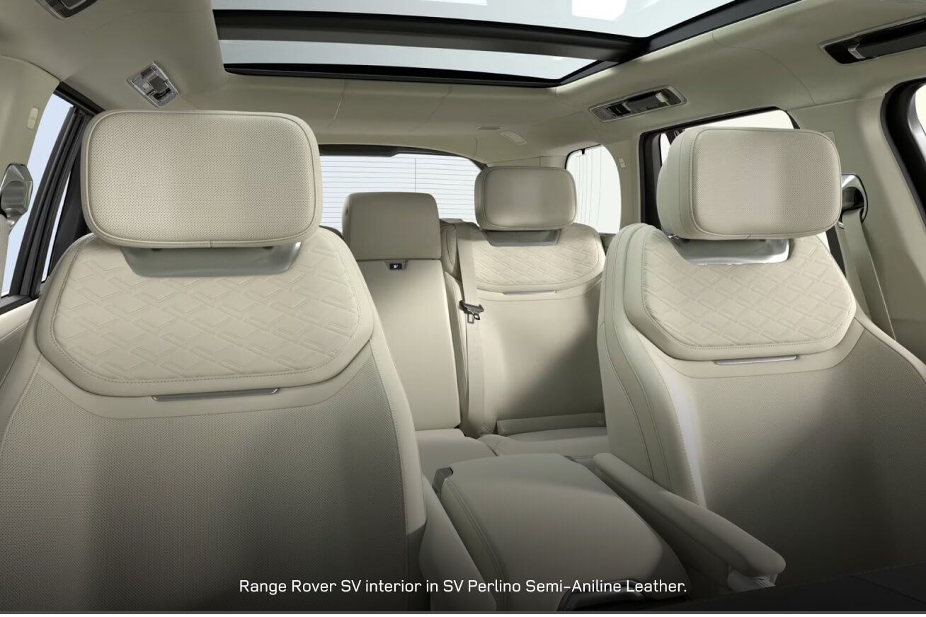 Interior cabin view of a Range Rover SV with an SV Perlino cabin looking back through the open sunroof.