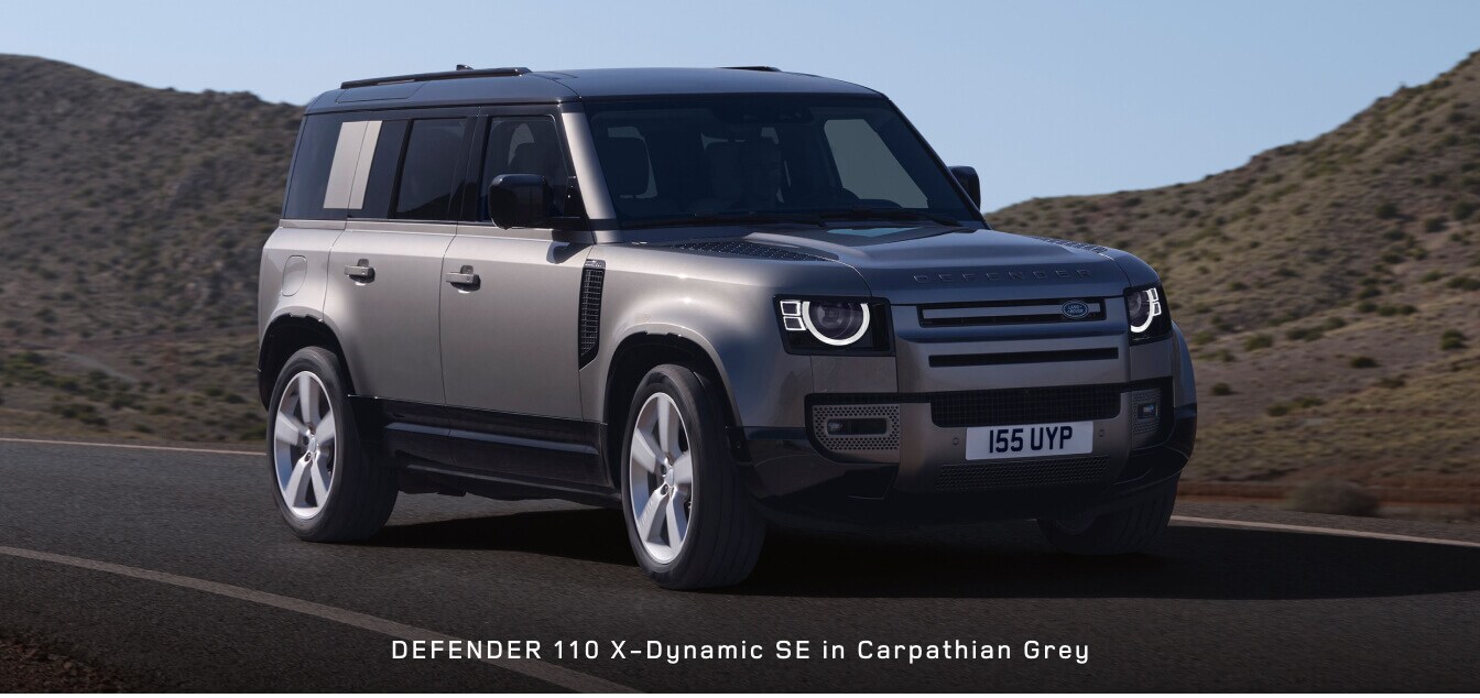 Front three-quarter view of a Land Rover Defender 110 X-Dynamic SE in Carpathian Grey.