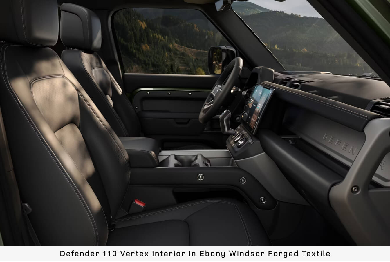 Side profile view of the front cabin inside a Land Rover Defender 110 Vertex in Ebony Windsor Forged Textile.