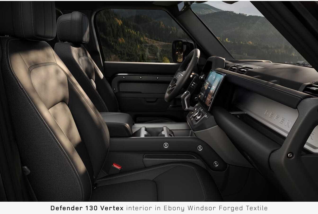 Side profile view of the front cabin inside a Land Rover Defender 130 Vertex in Ebony Windsor Forged Textile.