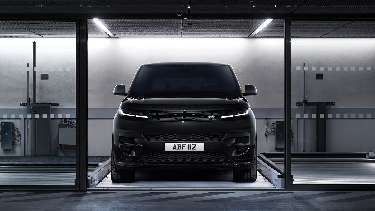 Front view of the 2025 Range Rover Sport in a dimly-lit setting Front view of the 2025 Range Rover Sport in a dimly-lit setting
