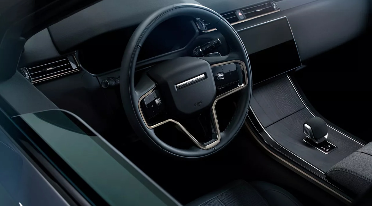 How Much Space is in the Range Rover Velar? A close-up view of the 2025 Range Rover Velar steering wheel and center console