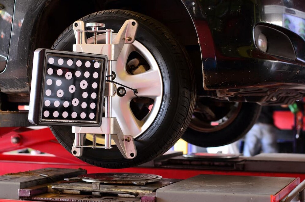 Defender Wheel Alignment Service in Huntington A vehicle undergoing wheel alignment service
