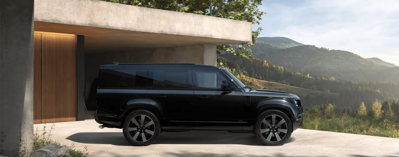2026%20Land%20Rover%20Defender%20130%20-%20Driveway.png Black 2026 Land Rover Defender 130 parked in a driveway