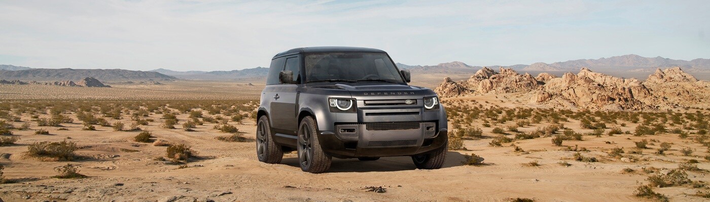 Defender 90 SUV Defender 90 SUV parked in the desert on a sunny day