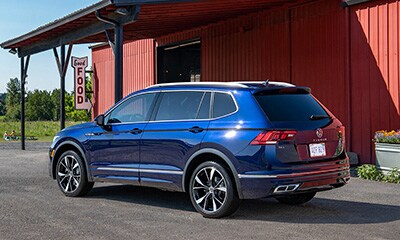 VW Tiguan VW Tiguan parked outside a roadside cafe.