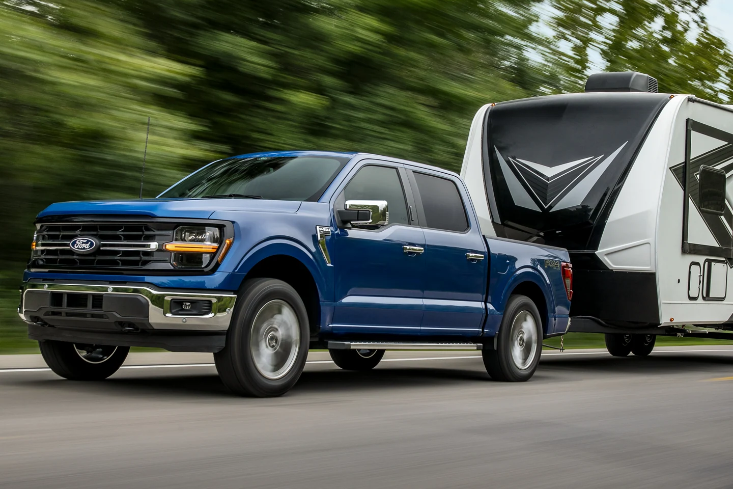 Ford F-150 towing a camper Lasco Ford near Linden Michigan