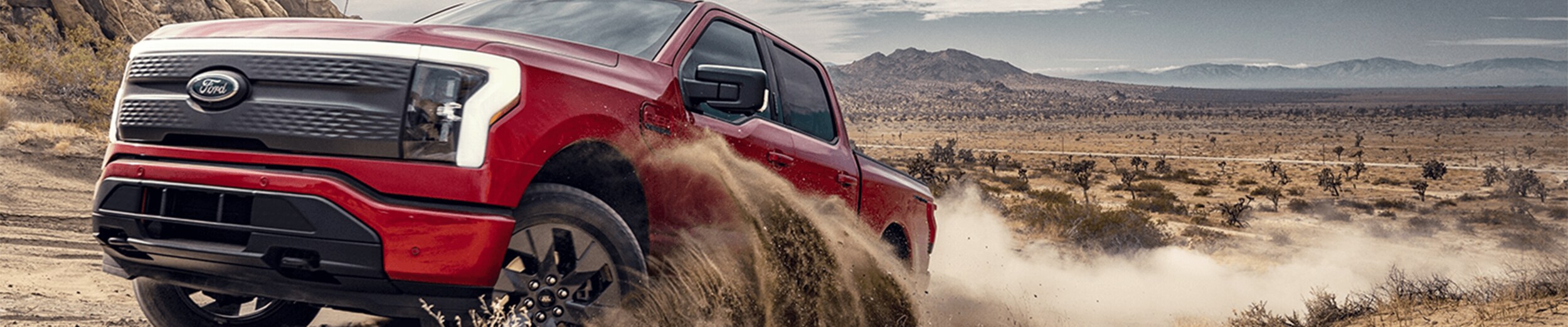 Ford F-150 Lightning racing along road