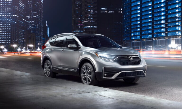 2021 Honda CR-V in night time city in grey exterior