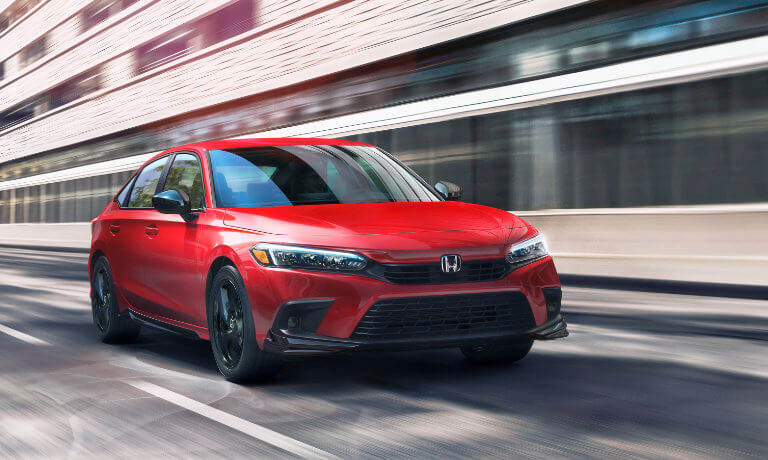 2022 Honda Civic exterior driving in the city during the day