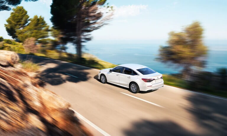2022 Honda Civic driving by body of water